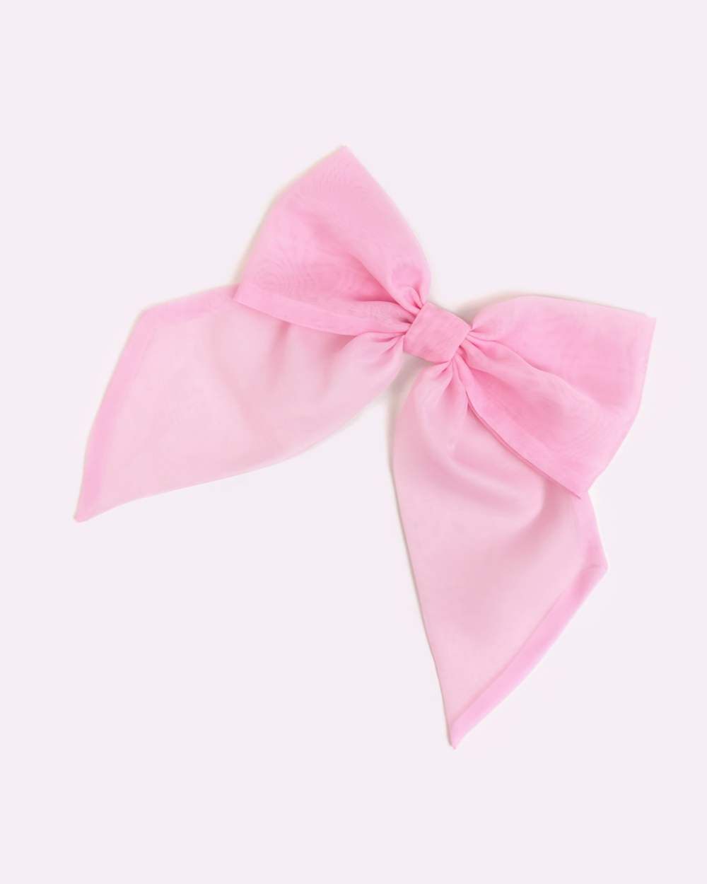 Pink brooch in the shape of a giant bow made of voile by melikestea.