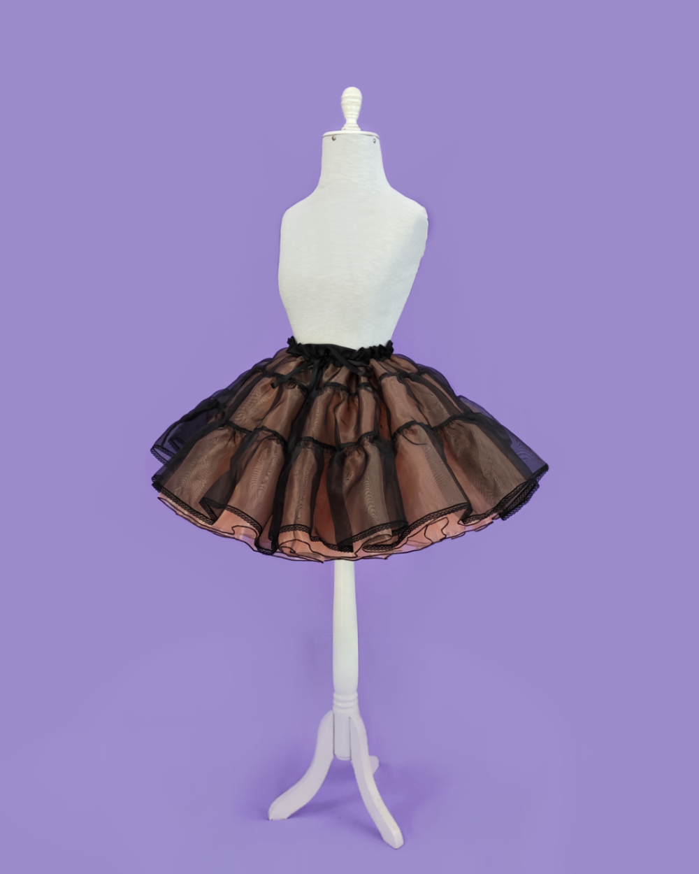 Cupcake-shaped petticoat, made of organza in black and cameo brown.