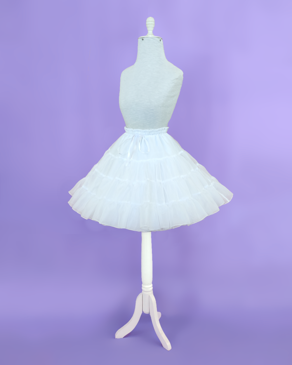 Petticoat shaped A-line made in white voile and lined.