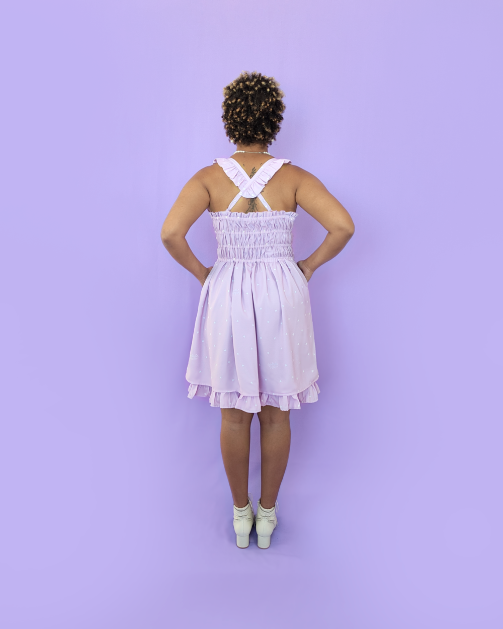 Model wearing a lavender dress with a heart print by melikestea