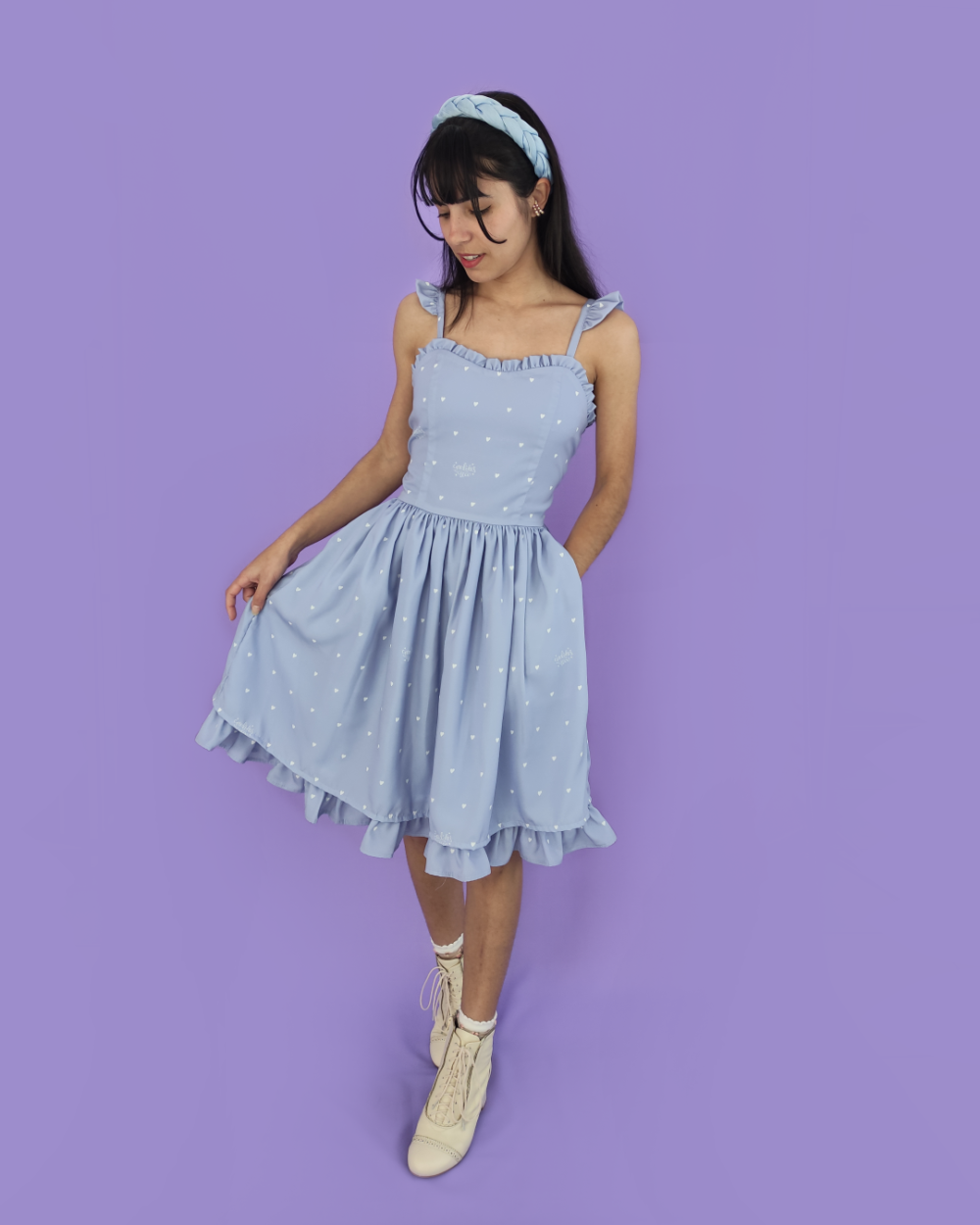 Model wearing a blue dress with a heart print by melikestea.