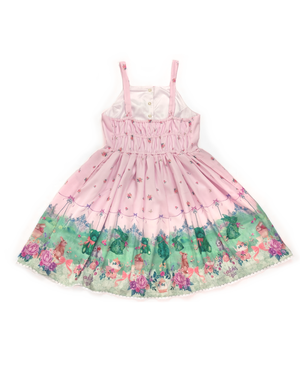 Dress made of pink polyester printed with a garden full of bunnies, teddy bears, cups and teapots, flowers and a beautiful lawn.
