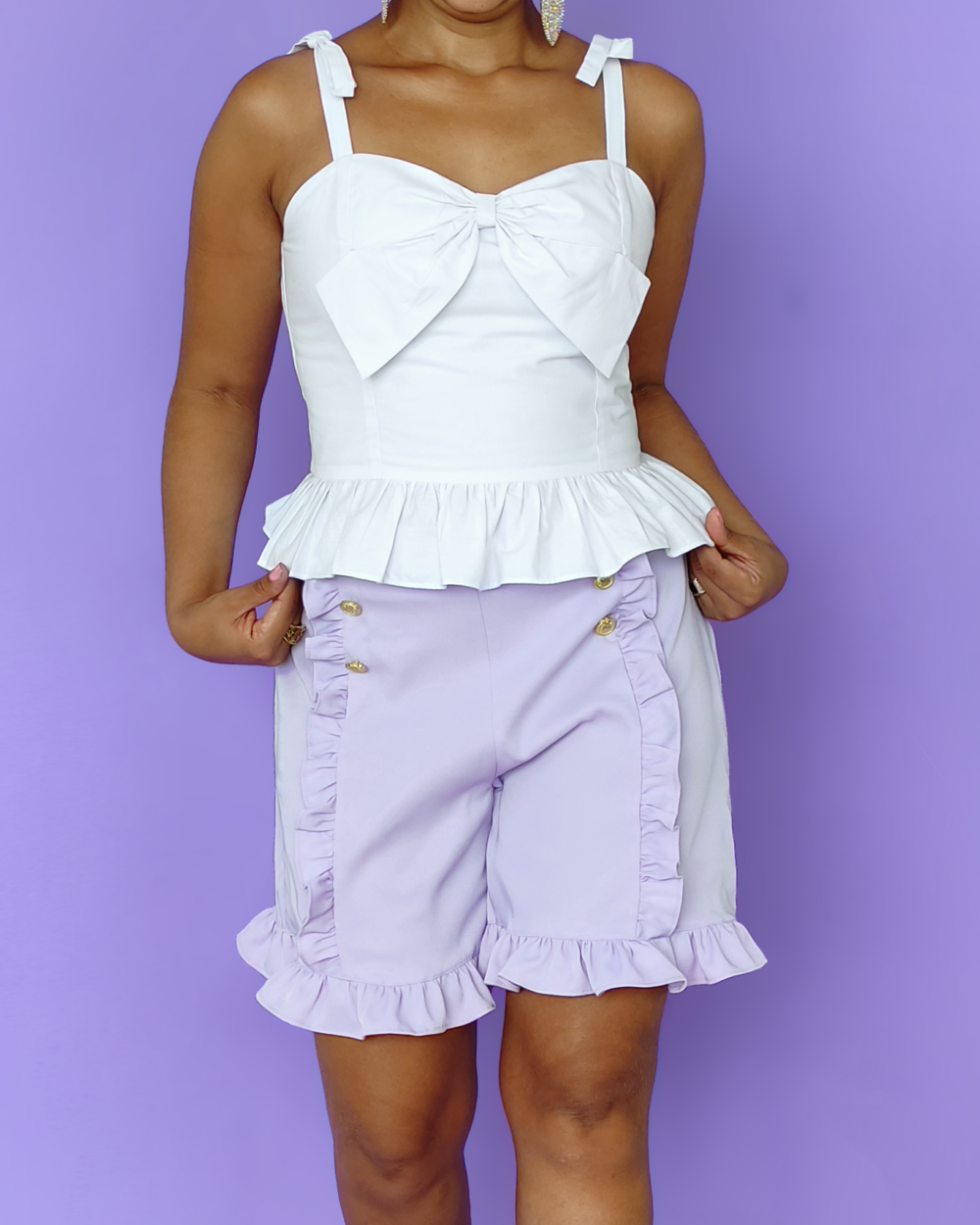 Model wearing lavender sailor shorts, with side zipper, back pockets and ruffles everywhere.