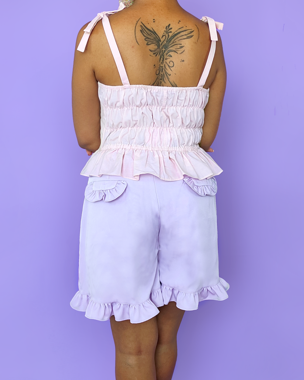 Model wearing lavender sailor shorts, with side zipper, back pockets and ruffles everywhere.